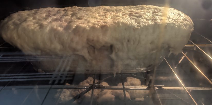 Dough dripping over the side into the oven